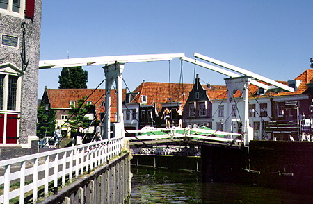 Lift bridge above the city canal that leads from the harbor in Enkhuizen. Netherlands.