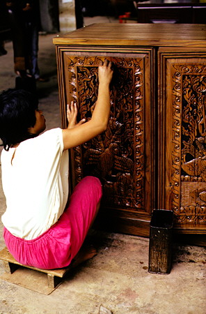 Hand made carved teak wood furniture in Chiang Mai. Thailand.