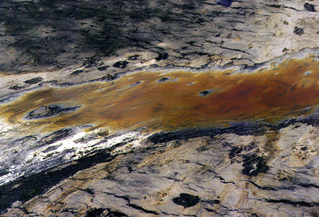 Sulfur rises to the top of the tar of Pitch Lake. Trinidad and Tobago.