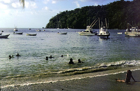People swimming at Charlotteville harbor. Trinidad and Tobago.