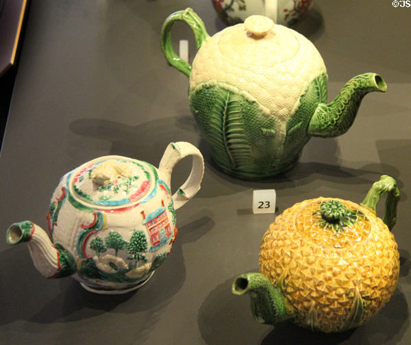 Ceramic teapots in village, cauliflower & pineapple shapes (c1750-70) from Staffordshire, England at National Museum of Scotland. Edinburgh, Scotland.