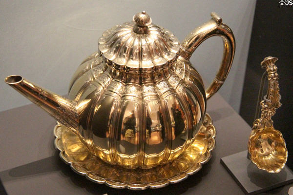 Silver gilt teapot & stand (1812-4) by Paul Storr of London & silver ladle based on German design (1812-3) by IR of London at National Museum of Scotland. Edinburgh, Scotland.