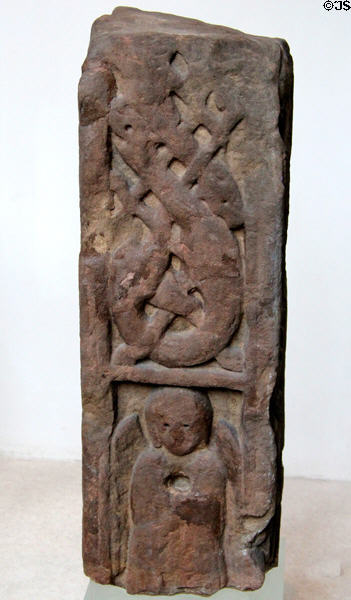 Pictish stone carved with intertwined animals above winged angel (c700-800) from Aberlady at National Museum of Scotland. Edinburgh, Scotland.