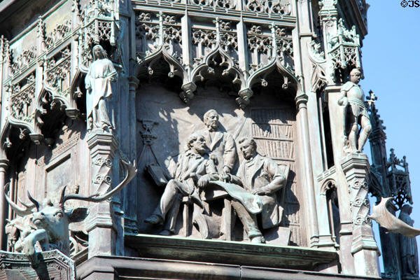 In library relief panel (1887) by William Birnie Rhind on Duke of Buccleuch statue. Edinburgh, Scotland.