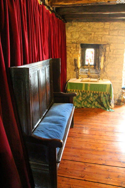 Church canon's room represents 1500s with settle & altar at Provand's Lordship. Glasgow, Scotland.