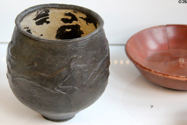 Romano-British ceramic Hunt Cup showing dog chasing hare at Hunterian Museum. Glasgow, Scotland.