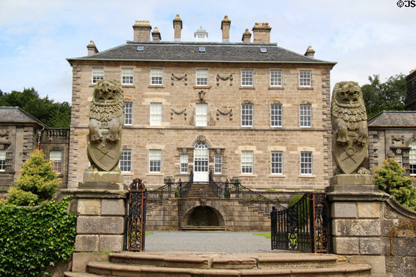 Carved lions guarding gates of garden entrance to Pollok House. Glasgow, Scotland.