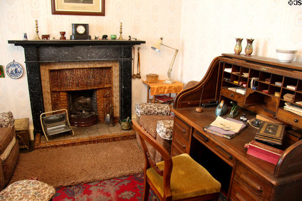 Parlor with black stone fireplace & roil-top desk (1907) in Reid farmhouse at National Museum of Rural Life. Kittochside, Scotland.