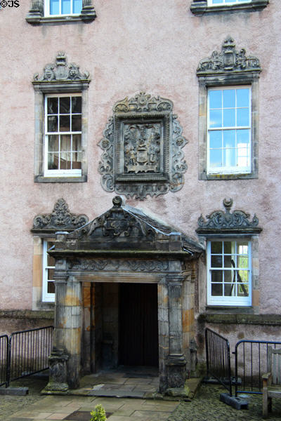 Arms of Nova Scotia supported by Native American & mermaid carved above entrance of Argylls Lodging (1632). Stirling, Scotland.