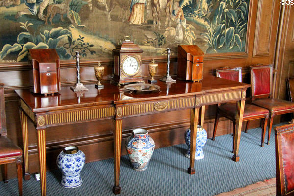 Side table with cutlery chests & table clock in dining room at Lauriston Castle. Edinburgh, Scotland.