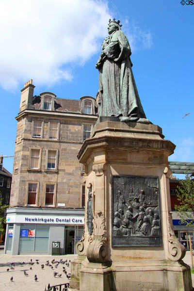 Queen Victoria statue marks her visit (1842) to harbor of Leith in town square on New Kirkgate St. Edinburgh, Scotland.