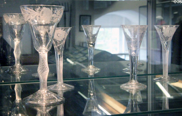Wine glasses engraved with Jacobite roses used for secret toasts to Stuart monarchs in exile at Traquair House. Scotland.