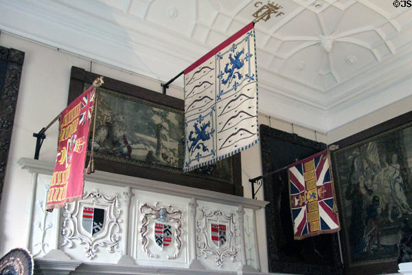 Billiard room fireplace with family crests & flags at Glamis Castle. Angus, Scotland.