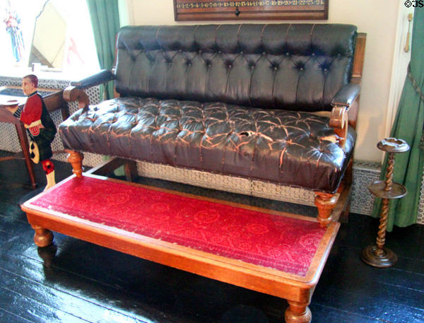 Elevated leather sofa for watching billiards in billiard room / library at Glamis Castle. Angus, Scotland.