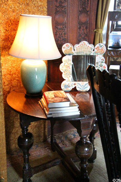 Drawing room round side table with lamp & mirror at Falkland Palace. Falkland, Scotland.