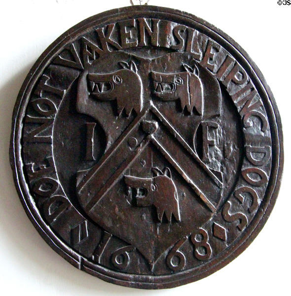 "Do Not Waken Sleeping Dogs" Forbes crest (1668) medal at Craigievar Castle. Alford, Scotland.