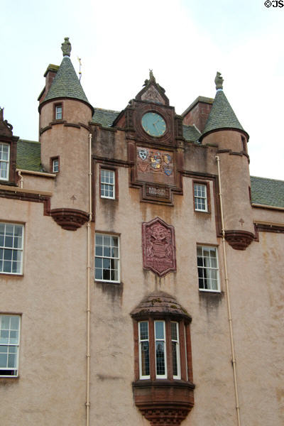 Facade with clock & carvings (1890) at Fyvie Castle. Turriff, Scotland.