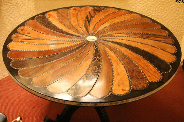 Round table inlaid with samples of many woods at Brodie Castle. Brodie, Scotland.
