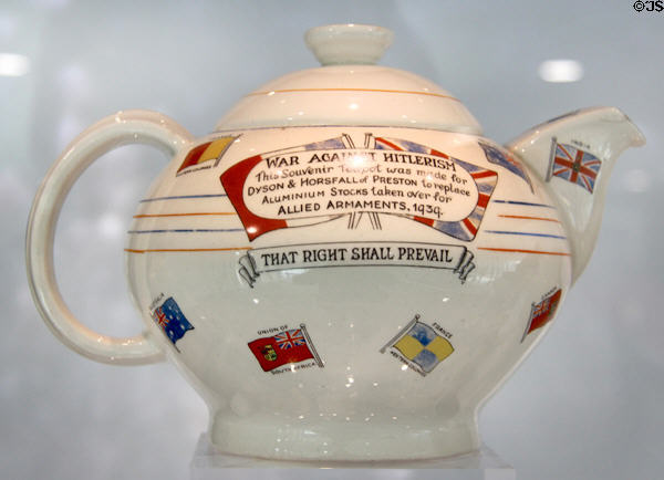 War Against Hitlerism earthenware teapot (c1940) by AG Richardon & Co Ltd. of Tunstall, Stoke as trade for Aluminum pots turned in for war effort at Potteries Museum & Art Gallery. Hanley, Stoke-on-Trent, England.