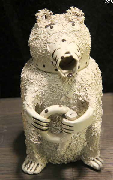 Bear jug where body is jug & head is cup covered with shreds of clay as fur (1735-50) made in North Straffordshire at Potteries Museum & Art Gallery. Hanley, Stoke-on-Trent, England.