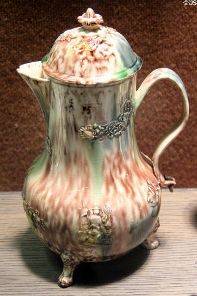 Earthenware jug stained with colored oxides under lead glaze & with applied molded relief decoration (c1750-70) prob. made in Straffordshire at Potteries Museum & Art Gallery. Hanley, Stoke-on-Trent, England.