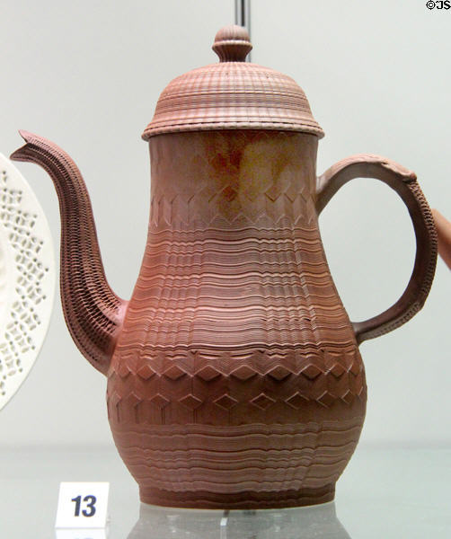 Red stoneware coffee pot with turned decoration (c1770) made in Straffordshire at Potteries Museum & Art Gallery. Hanley, Stoke-on-Trent, England.