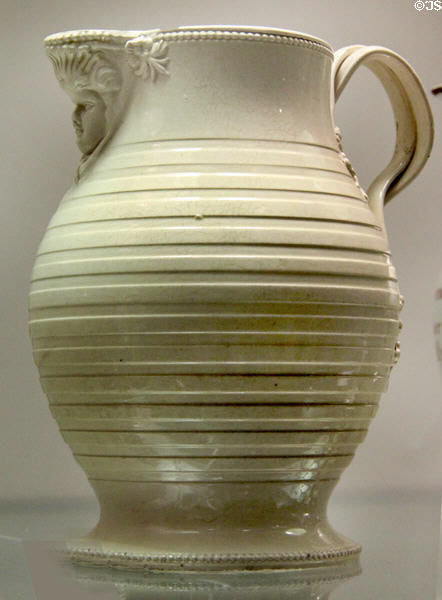 Thrown creamware jug with turned decoration (c1770-80) prob. made in Straffordshire or Yorkshire at Potteries Museum & Art Gallery. Hanley, Stoke-on-Trent, England.