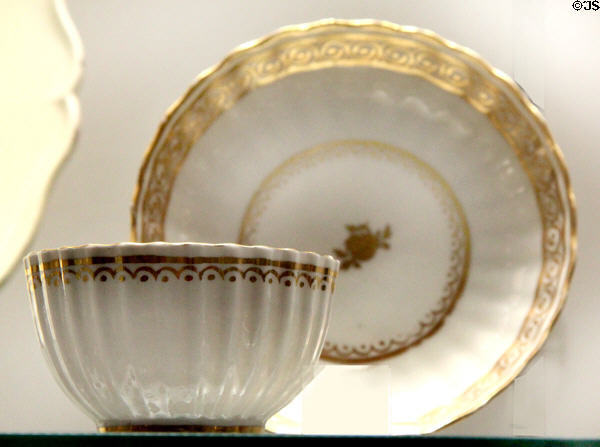 Porcelain teabowl & saucer with gold rim (1782-3) by New Hall, Tunstall, Straffordshire at Potteries Museum & Art Gallery. Hanley, Stoke-on-Trent, England.