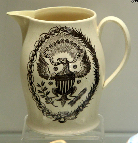 Creamware jug with over-glaze print of American coat-of-arms (c1800) by Thomas Baddeley of Shelton, Staffordshire at Potteries Museum & Art Gallery. Hanley, Stoke-on-Trent, England.