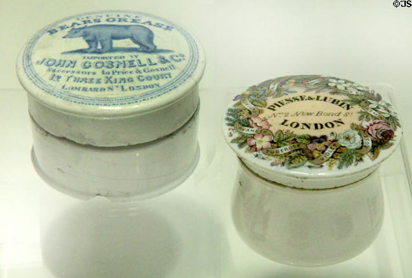 Earthenware bear grease hair ointment jar cover (c1840) & ironstone pot cover for Piesse & Lubin perfume (c1855-1905) both made in Staffordshire at Potteries Museum & Art Gallery. Hanley, Stoke-on-Trent, England.