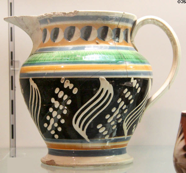 Earthenware jug with slip decoration (c1835) by Enoch Wood & Sons of Burslem, Staffordshire at Potteries Museum & Art Gallery. Hanley, Stoke-on-Trent, England.