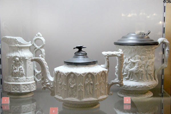 Stoneware relief molded Gothic revival vessels with Britannia metal lids (c1850) by Charles Meigh & Sons of Hanley, Staffordshire shown during Great Exhibition of 1851 at Potteries Museum & Art Gallery. Hanley, Stoke-on-Trent, England.