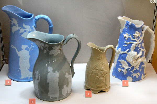 Earthenware jugs decorated with reliefs (c1850) by T&R Boote of Burslem, Staffordshire shown during Great Exhibition of 1851 at Potteries Museum & Art Gallery. Hanley, Stoke-on-Trent, England.