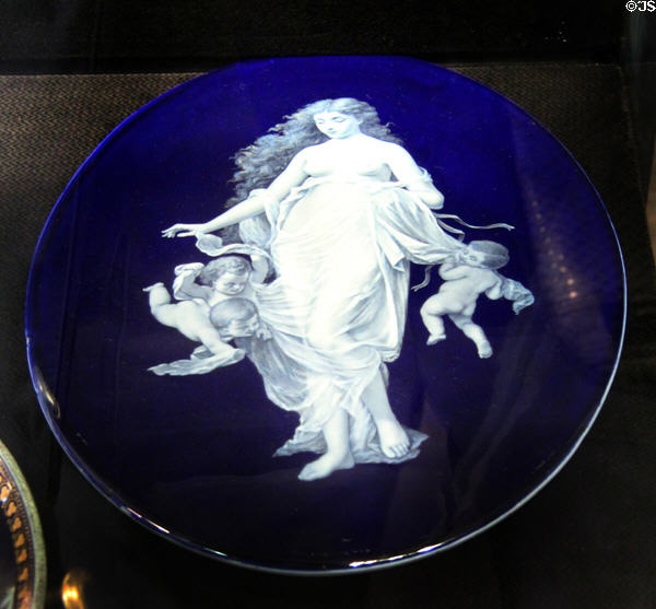 Porcelain plaque with white figure on blue ground (c1889-90) by T.C. Brown-Westhead for Moore & Co. of Hanley, Staffordshire at Potteries Museum & Art Gallery. Hanley, Stoke-on-Trent, England.