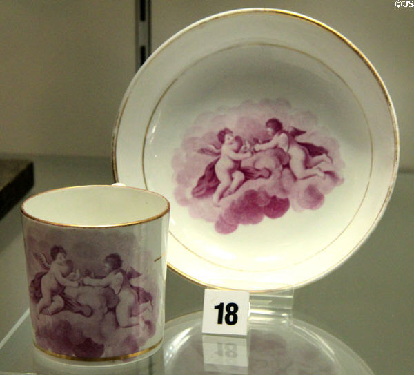 Example of over-glaze bat-printing on bone china coffee cup wherein a glue was transferred onto surface & then dusted with color before firing (c1800-10) by Miles Mason of Fenton, Staffordshire at Potteries Museum & Art Gallery. Hanley, Stoke-on-Trent, England.