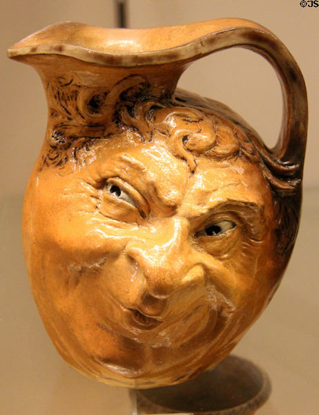 Ceramic jug modeled with leering face (1903) by R,W. Martin & Bros. of London & Southall at Potteries Museum & Art Gallery. Hanley, Stoke-on-Trent, England.