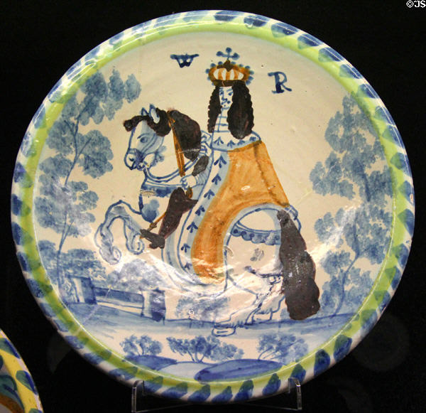 Tin-glazed earthenware charger painted with equestrian portrait of King William III (WR) (c1690) made in Bristol or Lambeth at Potteries Museum & Art Gallery. Hanley, Stoke-on-Trent, England.