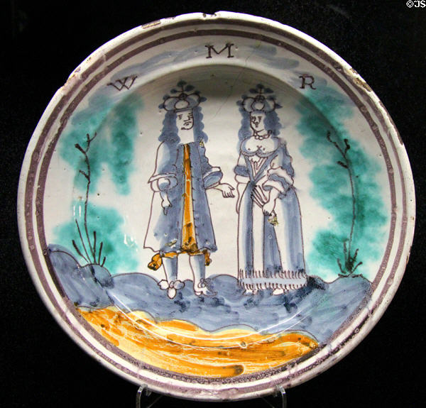 Tin-glazed earthenware charger painted with portrait of King William III & Queen Mary (WMR) (c1690) made in England or Holland at Potteries Museum & Art Gallery. Hanley, Stoke-on-Trent, England.