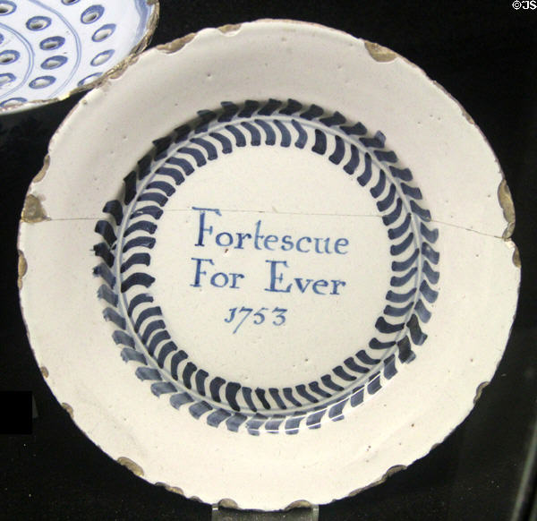Tin-glazed earthenware plate painted with Fortescue For Ever (1753). made in Bristol at Potteries Museum & Art Gallery. Hanley, Stoke-on-Trent, England.