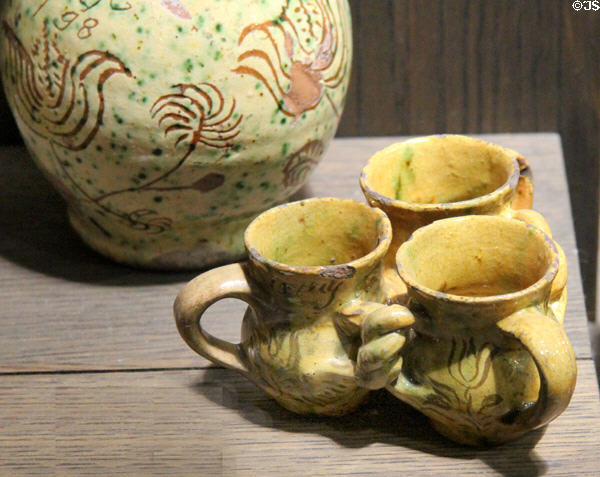 Fuddling cups decorated with white slip & scratches (c1775) made in Donyatt, Somerset at Potteries Museum & Art Gallery. Hanley, Stoke-on-Trent, England.