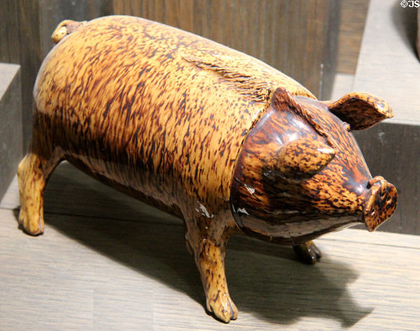 Earthenware pig-shaped jug made for 'hog's head of ale' wedding toast (c1870) made at Rye, Sussex at Potteries Museum & Art Gallery. Hanley, Stoke-on-Trent, England.