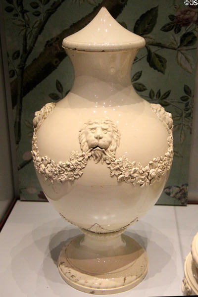 Creamware vase with conical lid decorated with lions holding garlands with traces of original gilding (1765-7) by Josiah Wedgwood at World of Wedgwood. Barlaston, Stoke, England.