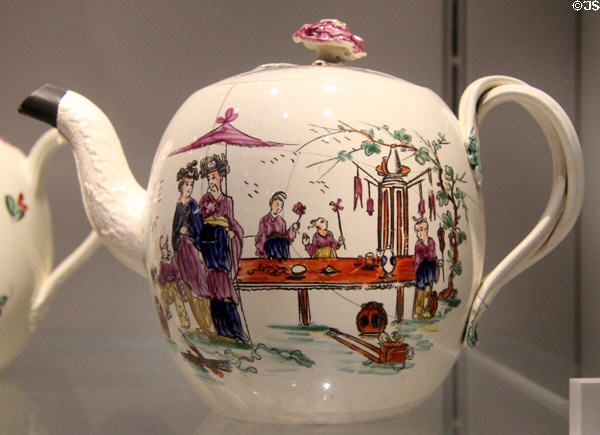 Queen's Ware teapot with painted Chinese figures (c1775) by Wedgwood at World of Wedgwood. Barlaston, Stoke, England.
