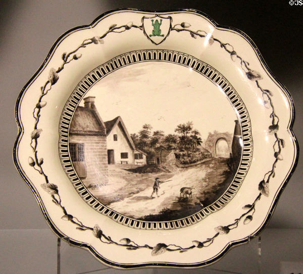 Queen's Ware dessert plate with painted English country scene (1773-4) by Wedgwood at World of Wedgwood. Barlaston, Stoke, England.