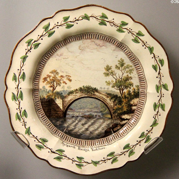 Queen's Ware dessert plate with painted Aysgarth Bridge, Yorkshire (1774-5) by Wedgwood at World of Wedgwood. Barlaston, Stoke, England.