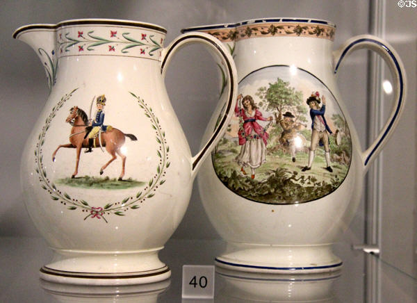Queen's Ware jugs painted (l) & partially transfer-printed outline then painted (r) (1786-90) by Wedgwood at World of Wedgwood. Barlaston, Stoke, England.
