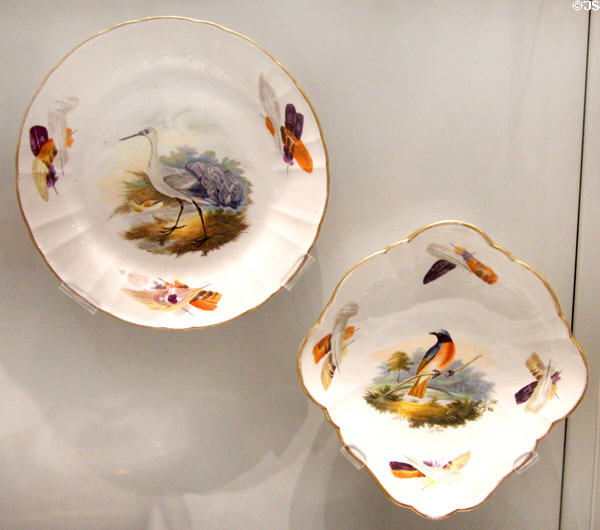 Wedgwood Bird Pattern 723 hand-painted dessert plates with birds in center & feathers on rim (c1815) by Aaron Steele at World of Wedgwood. Barlaston, Stoke, England.