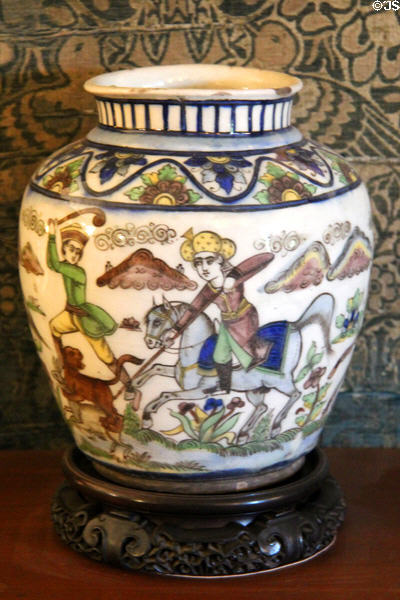 Persian earthenware jar painted with figures on a hunt (c1850-75) at Wightwick Manor. Wolverhampton, England.
