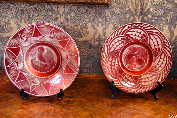 Ruby lustre plates with pelican & dragon (c1900) by Charles Passenger for William De Morgan at Wightwick Manor. Wolverhampton, England.