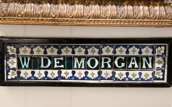 W De Morgan shop front tile sign (1886) by William De Morgan for showroom at 45 Great Marlborough St., London. England.